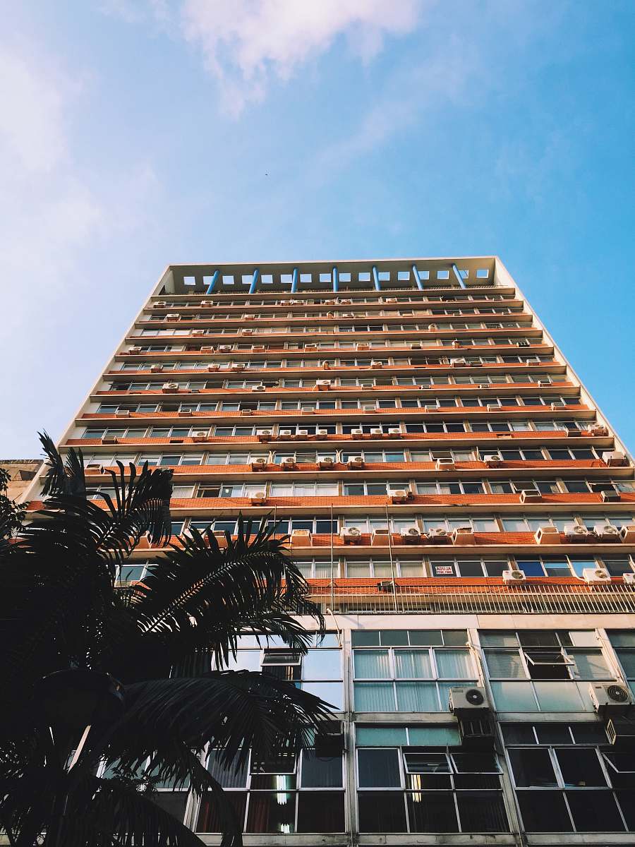 high rise orange and white painted high-rise building porto alegre